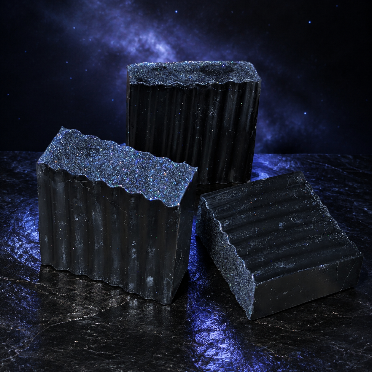 Three Galaxy Glitter handcrafted black soap bars in a dark cosmic product scene